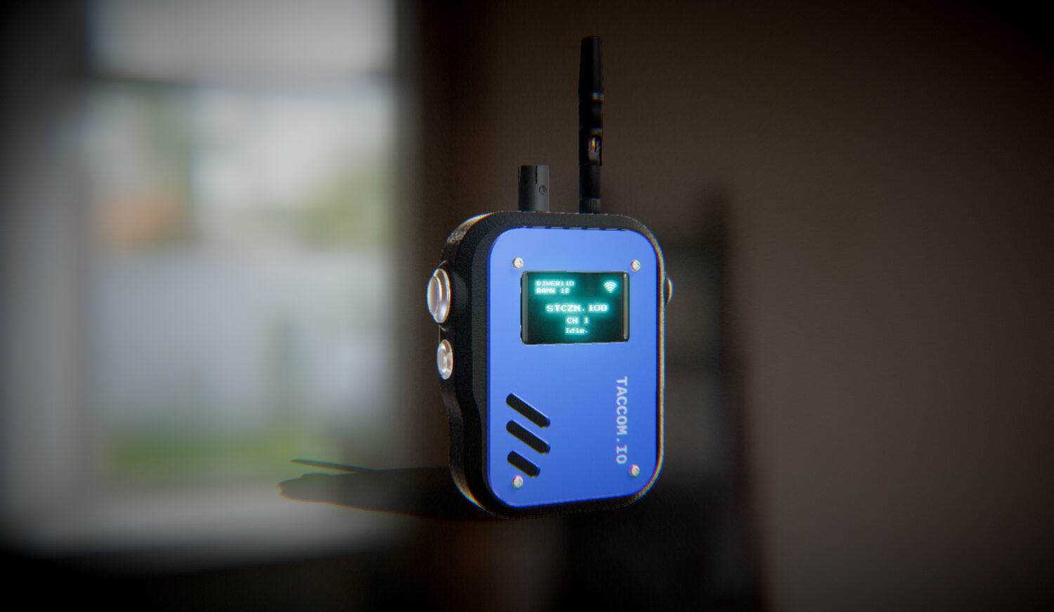TACCOM radio with black shell and cobalt faceplate